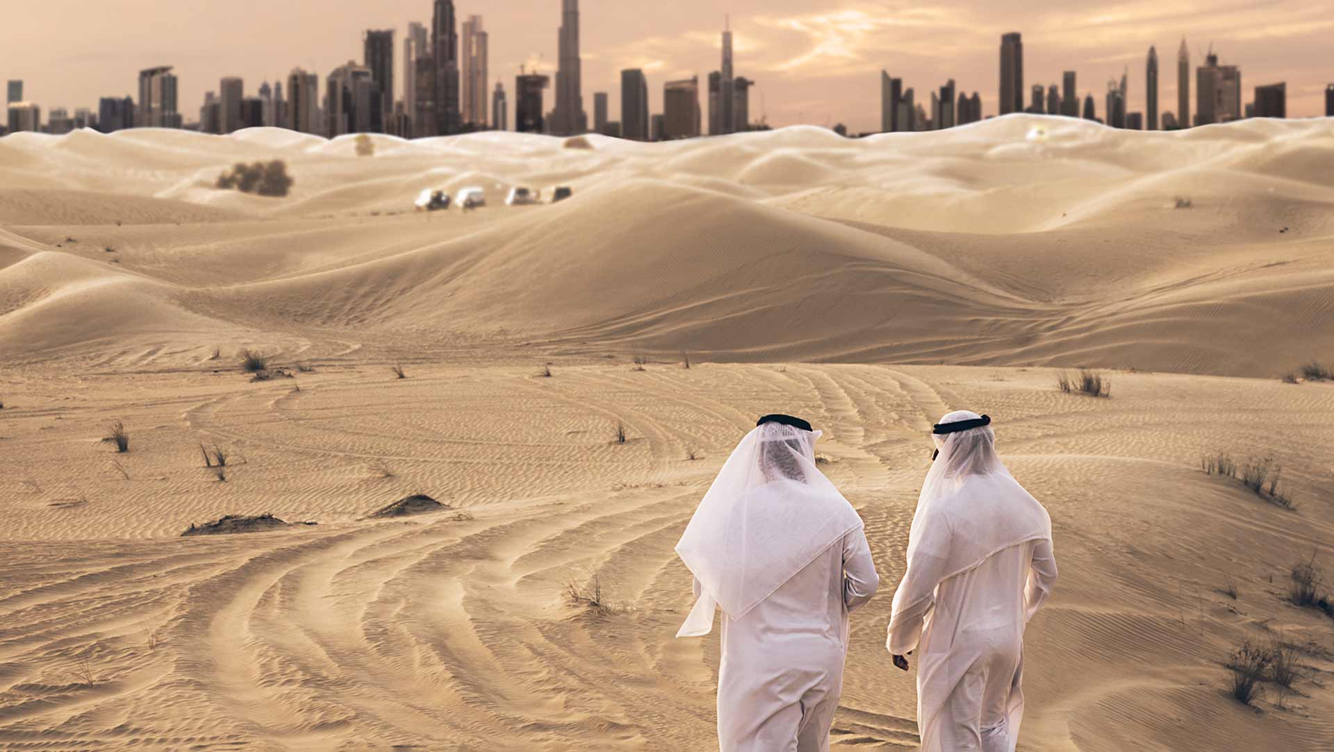 Two Friends Walking in Desert with view of Dubai